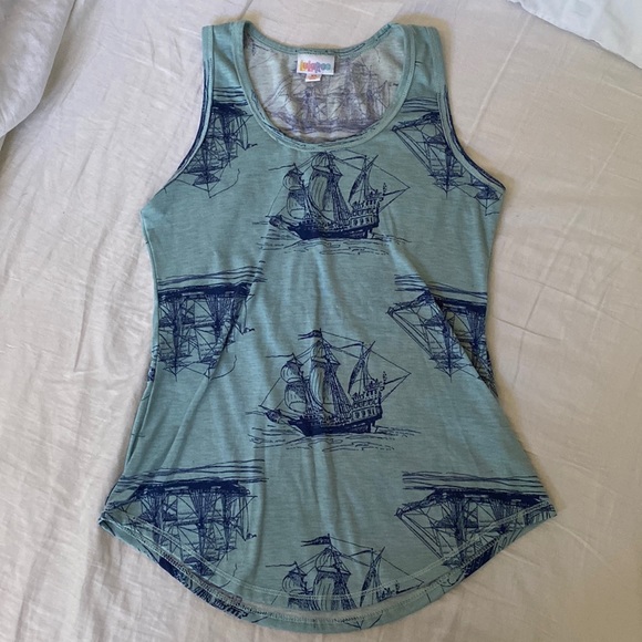 LuLaRoe Tops - Lularoe woman’s light blue with dark blue ships size xs